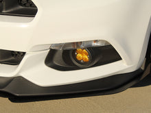 Load image into Gallery viewer, Close-up of a Ford Mustang's front bumper with the fog lights on, showcasing the conversion product.